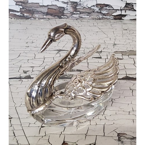 127 - A continental silver mounted glass trinket dish in the form of a swan, articulated wings, stamped EL... 