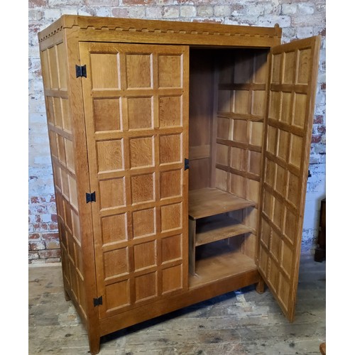 164 - Rabbitman: Peter Heap (Wetwang): An English golden oak Panelled Wardrobe, with two doors, opening to... 