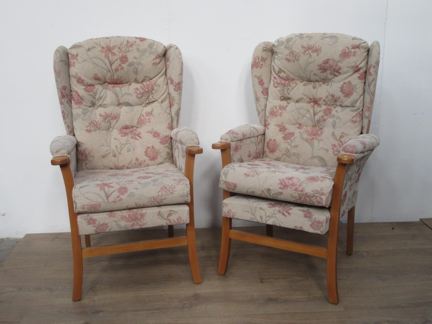 A pair of upholstered Armchairs.