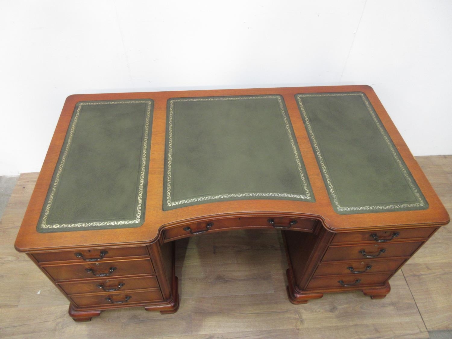 A reproduction mahogany Pedestal Desk by Shaw of London with leather