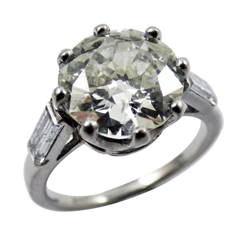 107 - An Art Deco French platinum single stone diamond ring, claw set with an old brilliant cut stone, cal... 