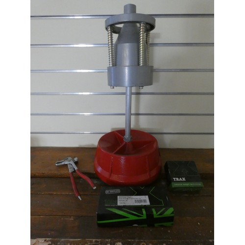 37 - A manual wheel balancer with weights and gripper.