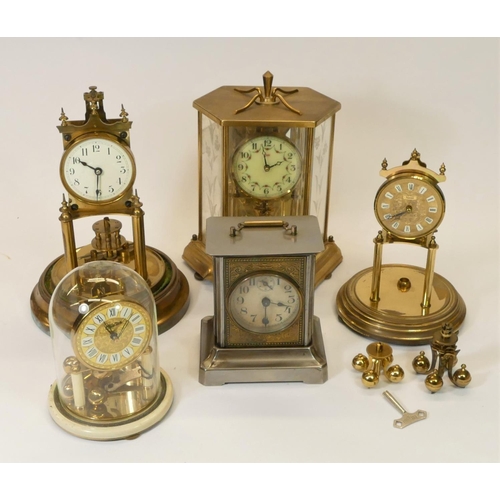 A collection of clocks to include, manual wind anniversary clocks and a