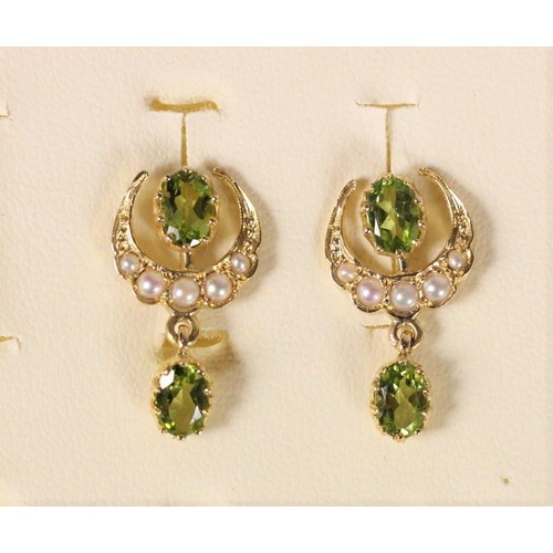 93 - A pair of Edwardian gold, peridot and half pearl ear studs, unmarked, later stud fitting, overall le... 