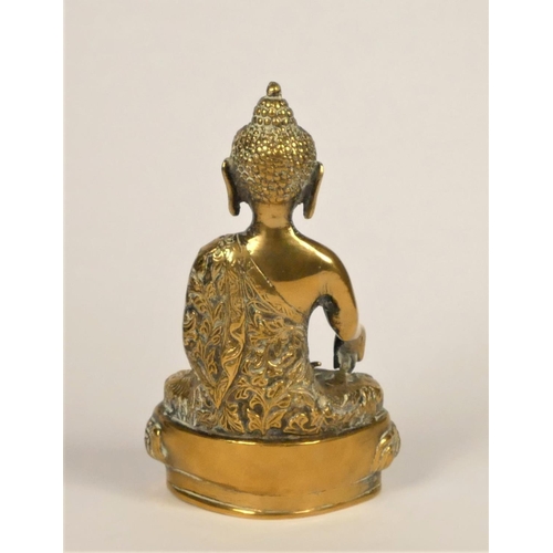 282 - A Thai bronze Buddha, with crossed legs and right hand out stretched, 20cm