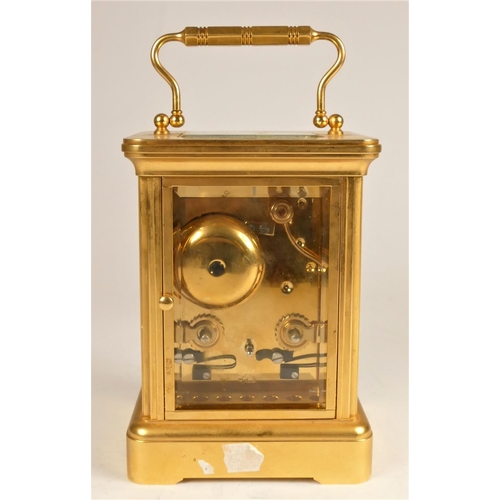 307 - Mappin & Webb, London, a brass 1/2 hour striking carriage clock, the white enamel dial with Roman nu... 