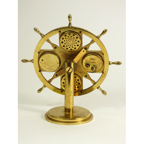 124 - Angelus weather station clock, in the form of a brass ship's wheel on round stepped base, with five ... 