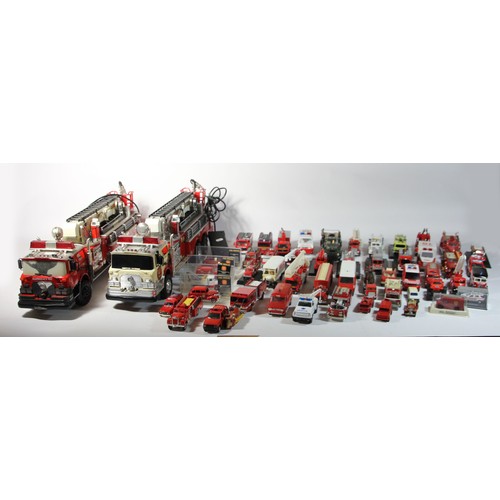 44 - Two remote control models of fire engines, together with a selection of diecast models, makers to in... 