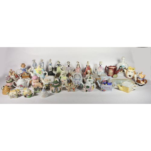 61 - A collection of ceramics and other wares, to include novelty teapots, figurines, animal models and o... 