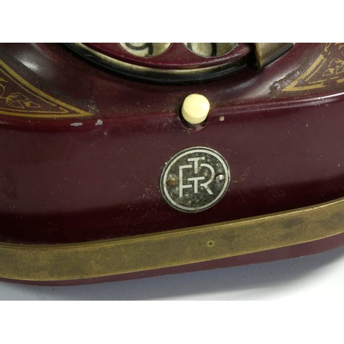 91 - A Bell Telephone by the MFG Company, with brass carry handle, painted metal casing and Bakelite rece... 
