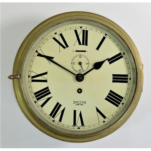102 - A Smith Astral bulk head clock, brass case, hinged door (no glass), painted dial with seconds dial, ... 