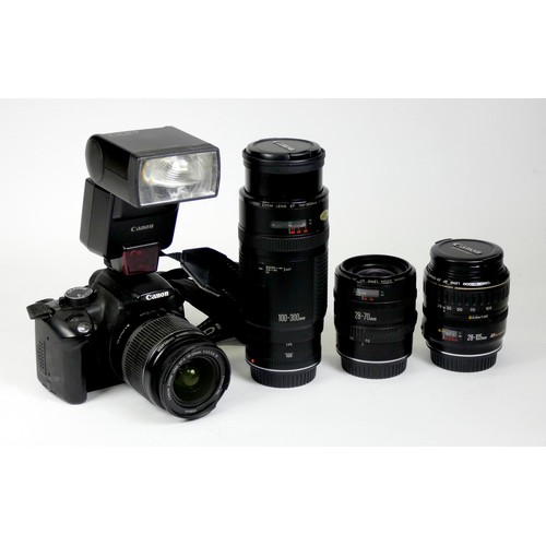 172 - A Canon EOS Rebel XT digital camera, carry case and manual, together with four lenses, to include a ... 