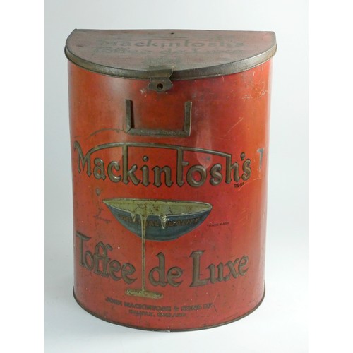 176 - A Mackintosh's Toffee De Luxe shop counter advertising tin, c.1920, flat back, moon shaped, 36cm tal... 