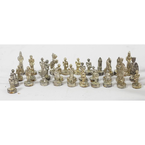 229 - A collection of three sets of cast chess pieces, one complete set, in silver, gold and bronze gilt