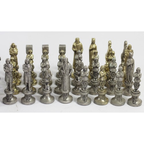 229 - A collection of three sets of cast chess pieces, one complete set, in silver, gold and bronze gilt
