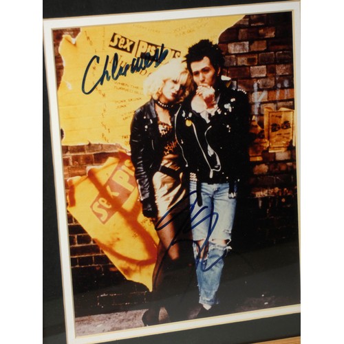323 - A signed print of Gary Oldman and Chloe Webb from the film Sid and Nancy, signed print mounted along... 