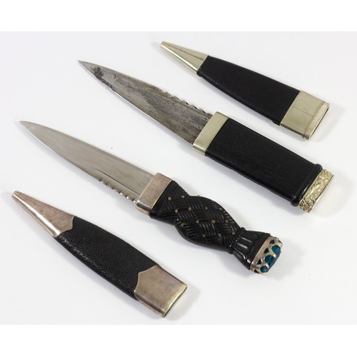 359 - A Scottish Sgian Dubh, the wood hilt with woven and stud decoration, green paste pommel, leather sca... 