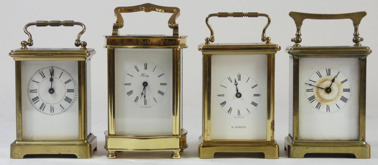 Four brass cased manual wind carriage clocks, comprising of an English "Henley" of London example an