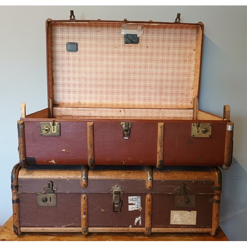 29 - Two beech bound traveling trunks, early 20th Century, having leather carrying straps, brass locks & ... 