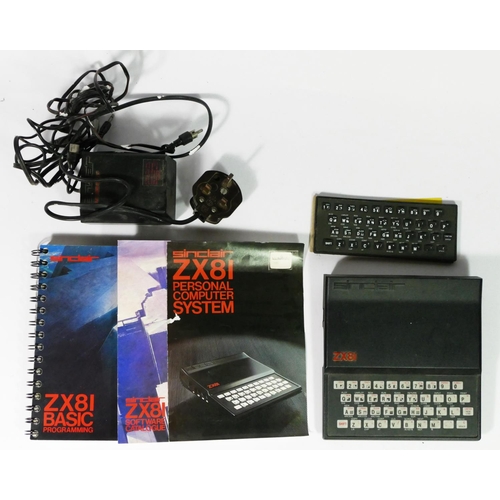 A Sinclair ZX81, AV and power cables, keyboard, manual, Basic ...