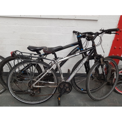 A Btwin Rock rider 520 and a Trek 7000 