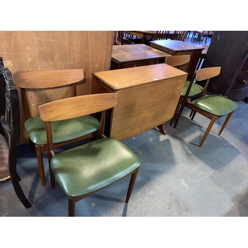 136 - A mid century teak G Plan drop leaf dining table and four chairs