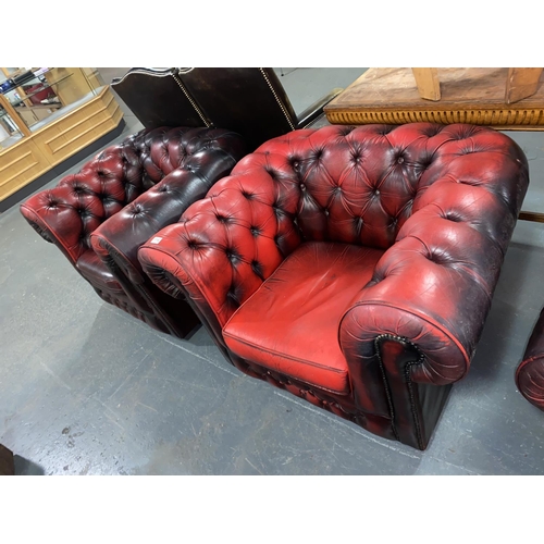 114 - Two red leather Chesterfield armchairs