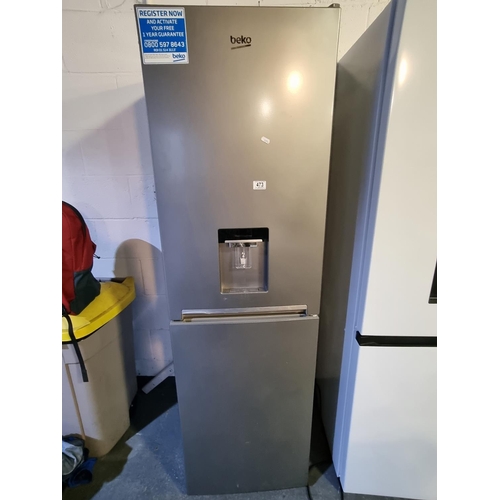 A Beko fridge freezer with water dispenser