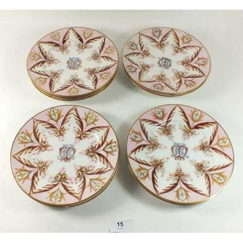 15 - A set of nine 19th century tea plates painted in pink and gilt with monogram to centre
