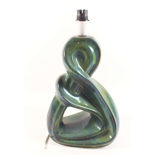 25 - A lustred green pottery 'twisted' table lamp, 30cm