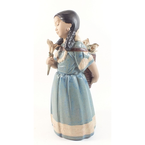 29 - A Nadal pottery figure of a girl