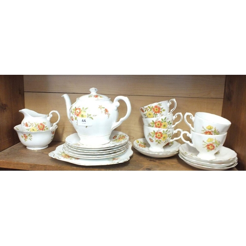 44 - A Tuscan floral tea service comprising: six cups and saucers, teapot, jug and sugar and cake plate