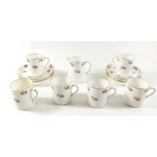 60 - A Tuscan Plant coffee set painted flowers comprising six coffee cans, saucers and a milk jug