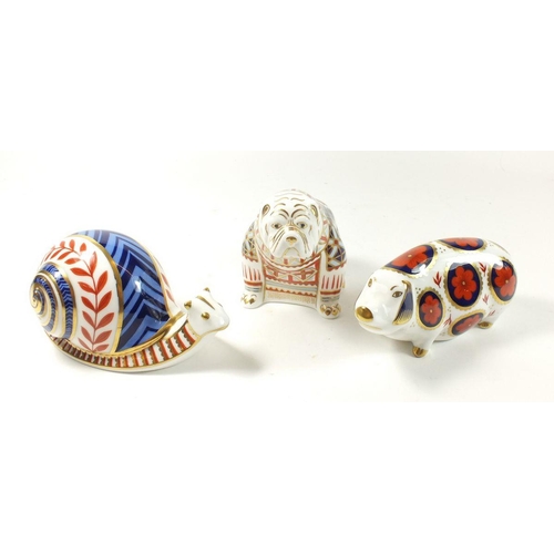 9 - A group of three Royal Crown Derby Imari paperweights in the form of a pig, snail and bulldog (no se... 