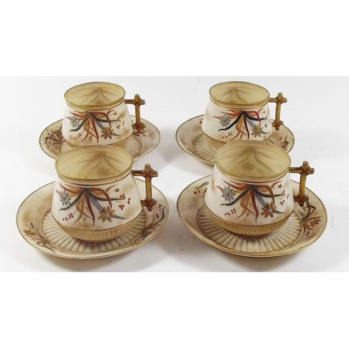 483 - A set of four Belleek 1st period cups and saucers painted flowers on a gilt and cream ground