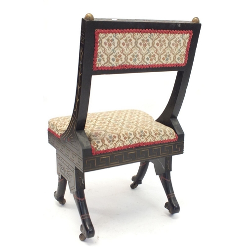 972 - An early 19th century small ebonised chair in the Empire style with incised and painted decoration, ... 