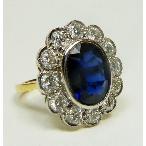 294 - A fine 18ct gold large sapphire and diamond oval cluster ring, estimated sapphire weight 4.25ct, siz... 