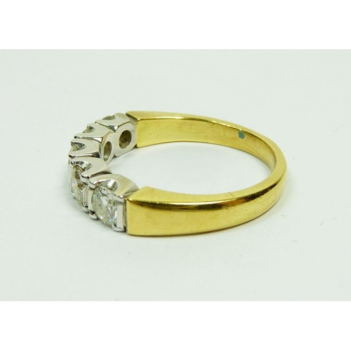 296 - An 18ct gold five stone diamond ring, total estimated diamond weight 0.96ct, size O, 6g