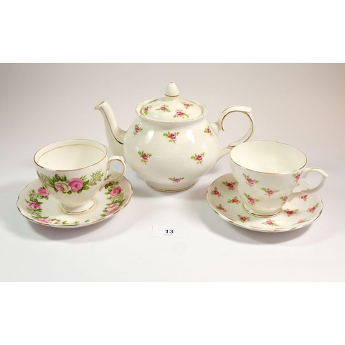 13 - A Colclough tea service printed flowers comprising ten cups and five saucers, two sugars, jug, eleve... 