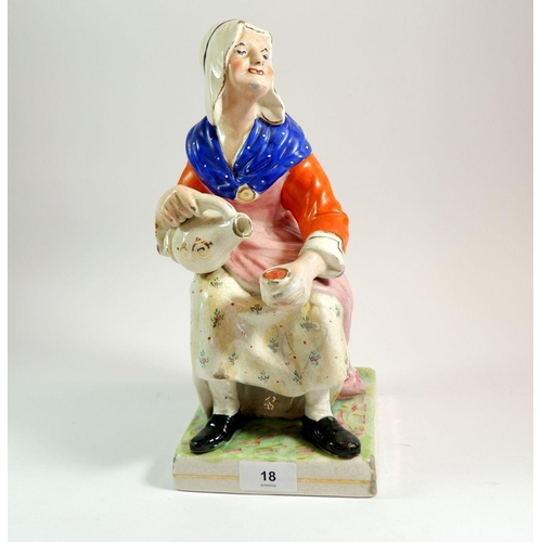 18 - A Victorian large Staffordshire figure of woman seated with flagon, 31cm tall
