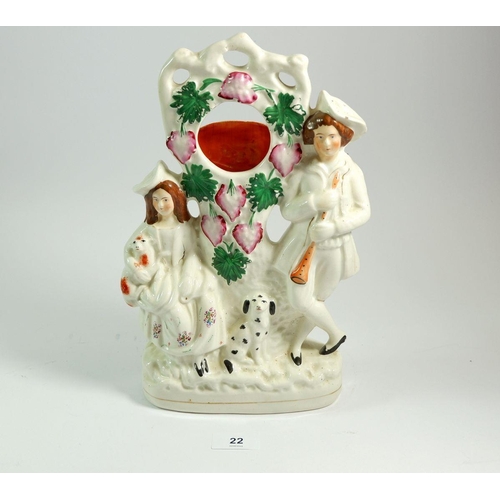 22 - A Victorian Staffordshire watch stand with woman and dog, 30cm