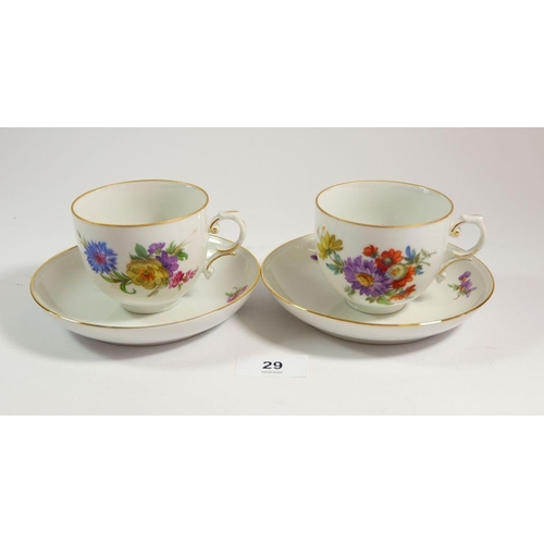 29 - A floral painted set of seven tea cups and saucers