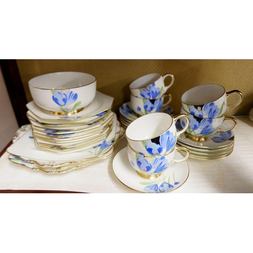 3 - A Paragon 1930's tea service painted blue flowers comprising: six cups, ten saucers, twelve side pla... 