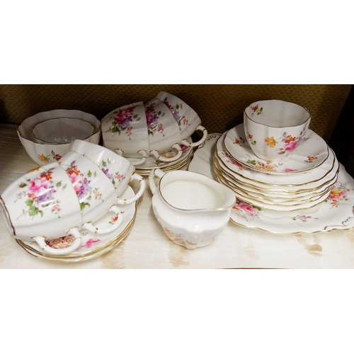 4 - A Royal Crown Derby tea service printed flowers comprising: seven cups (one a/f) and seven saucers, ... 