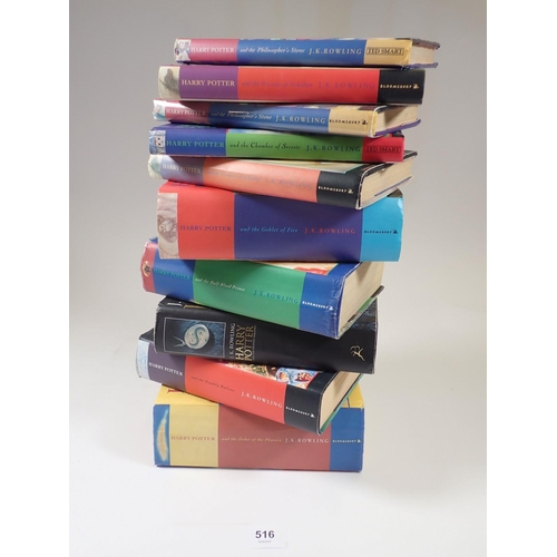 516 - A box of Harry Potter books including two Philosophers Stone hardbacks