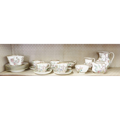 9 - A Coalport Indian Tree part tea service comprising: four cups and saucers, five tea plates, two jugs... 