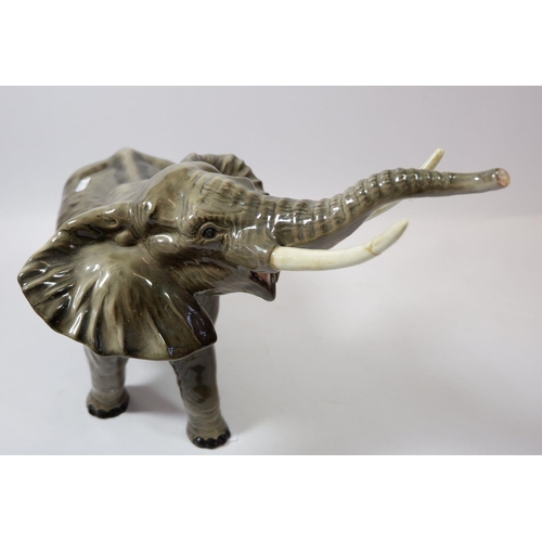 11C - A large Beswick elephant, tusk a/f, 25cm tall