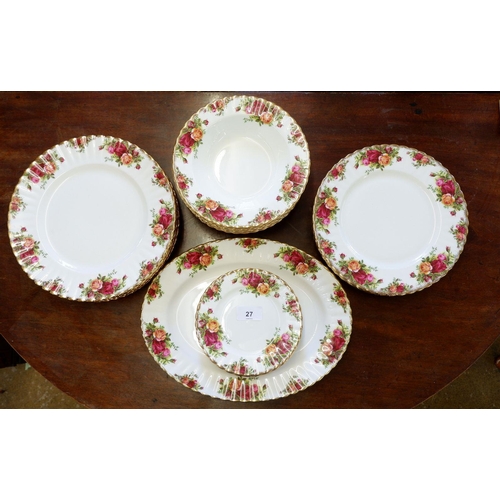 27 - A Royal Albert 'Country Roses' dinner service comprising: meat plate, seven soup plates, six dinner ... 