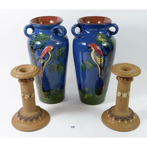 30 - A pair of Torquay Ware vases, 25cm painted parrots and a pair of Doulton Silicon Ware candlesticks