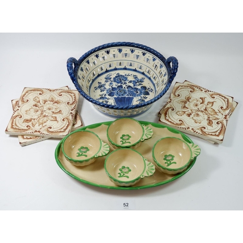 52 - A Gustavesberg set of four entree dishes on stand, four tiles and a Delft basket